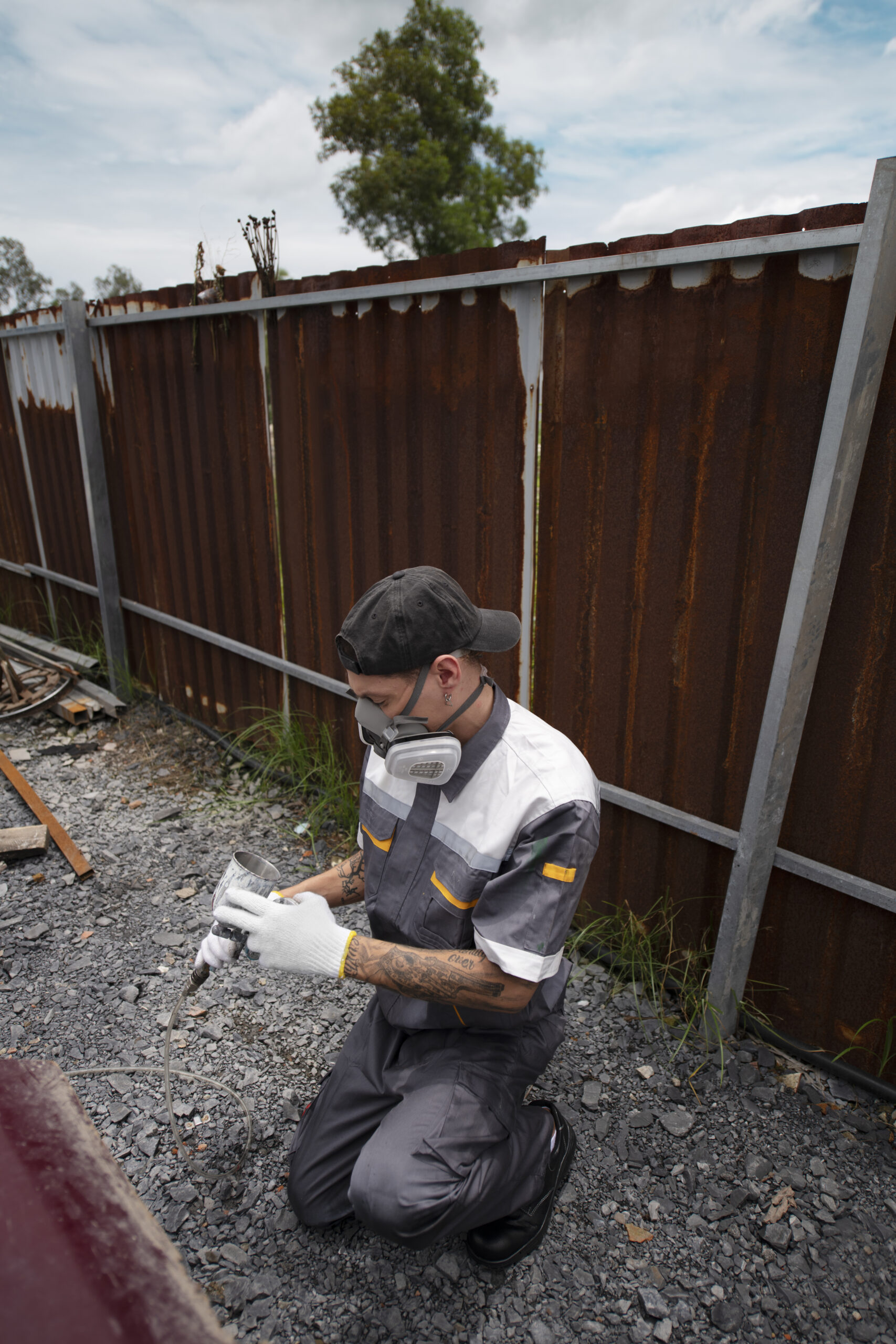 full shot man spraying powder paint